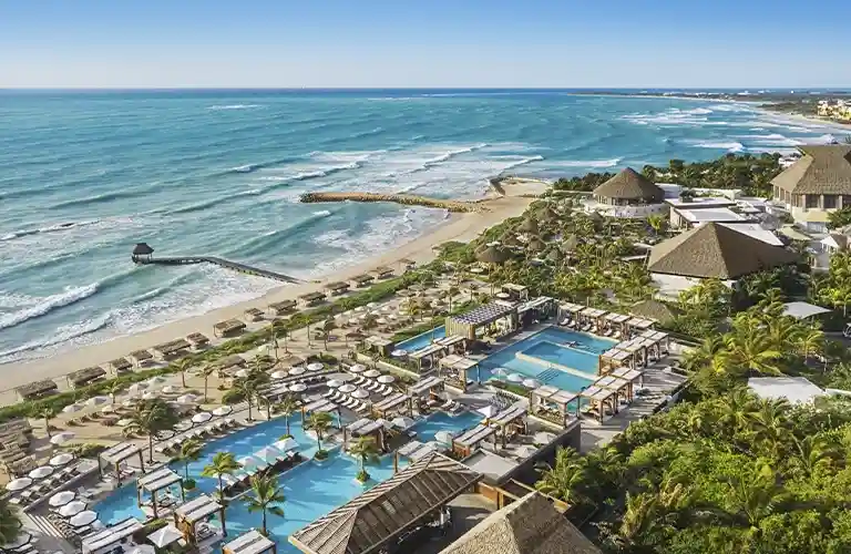 https://develoment.sqnescapes.com/Riviera Maya Vidanta resort showcasing lush greenery, sparkling pools, and luxurious accommodations